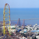 The Top Thrill Dragster, with Lake Erie as a backdrop. The notably larger red-framed coaster is the Magnum XL-200.